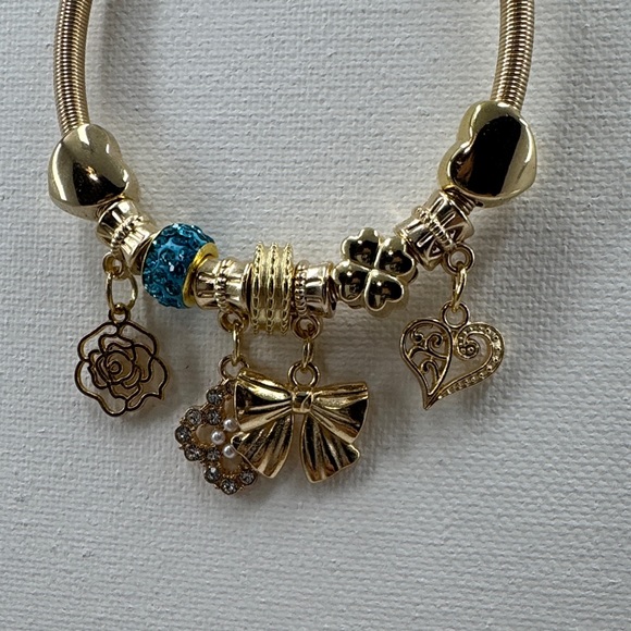 Gold tone Charm stretchy Bracelet with Blue Accents - Picture 3 of 5